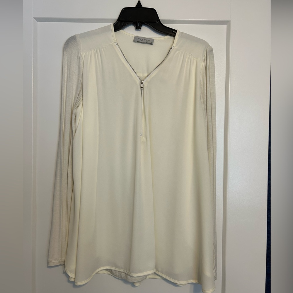 Lola & Sophie cream blouse. Zipper front detail. Flowy back detail. Small